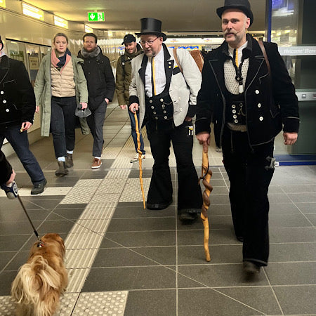 Traditional traveling woodworkers in their distinctive journeyman attire